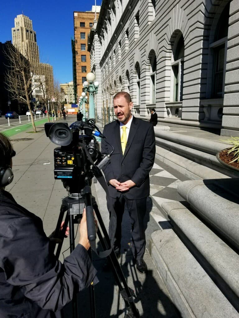 Bob Hoban being interviewed at courthouse